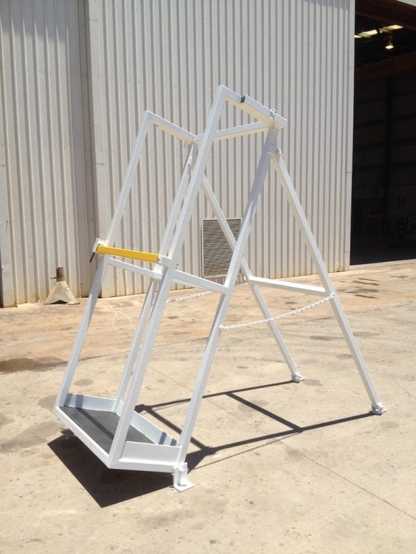 Vertical drill rod racks for underground drill rigs