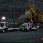 Two boilermaking service trucks providing equipment for servicing Komatsu PC8000 shovel during night shift
